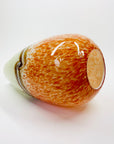 Vintage hand made orange cased art glass vase with abstract pattern