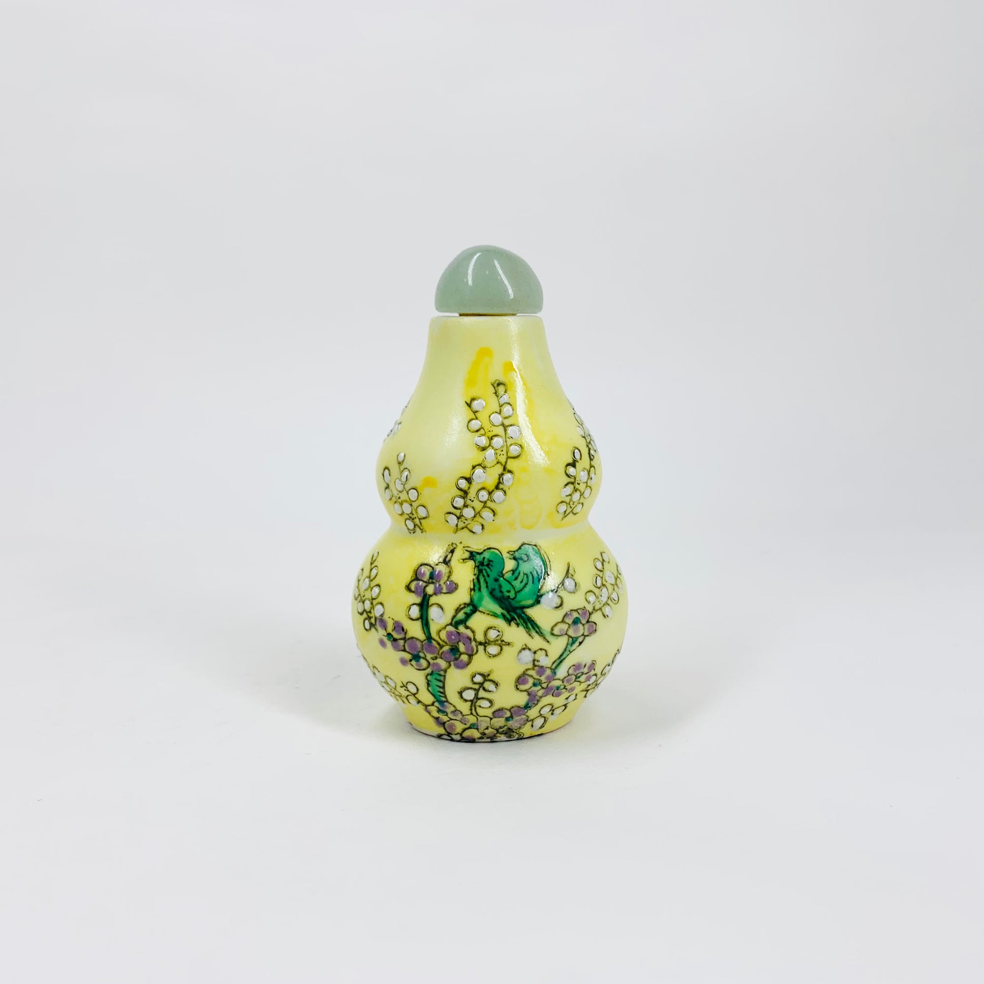 Antique Chinese hand painted yellow porcelain snuff bottle with jade stopper