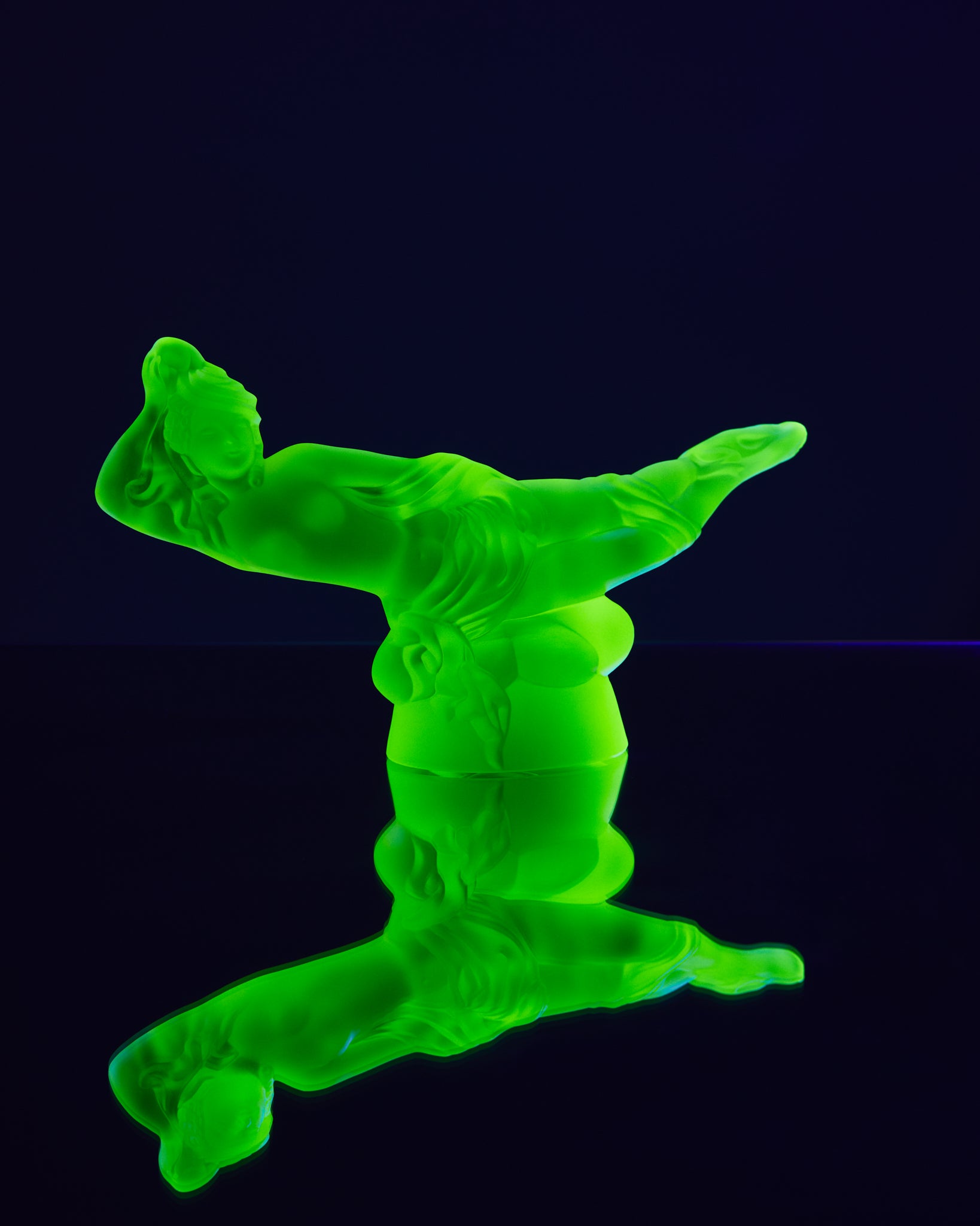 Art Deco reproduction of Lalique lie down Nude with star bangle cape figurine in uranium glass