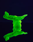 Art Deco reproduction of Lalique lie down Nude with star bangle cape figurine in uranium glass