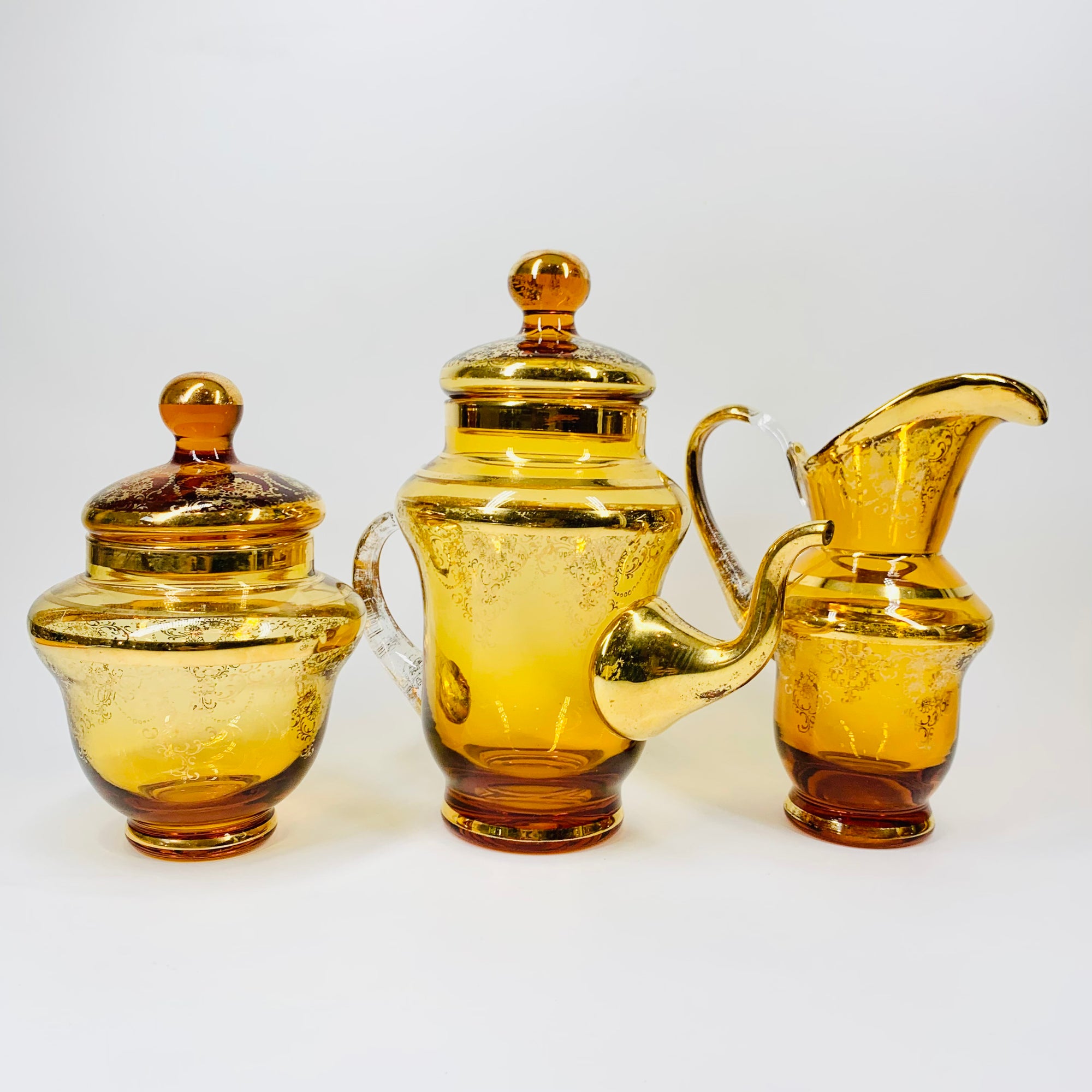 Antique Bohemian amber glass tea set with gold gilding