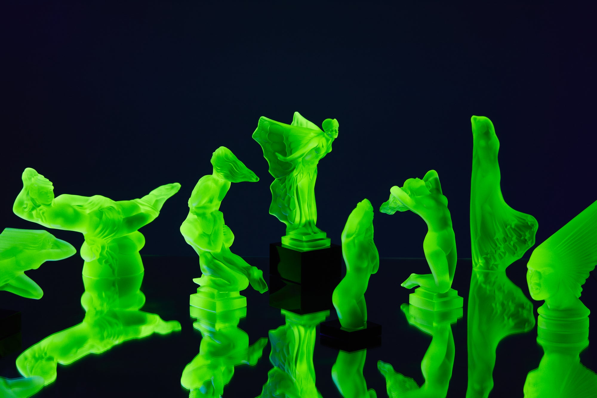 Art Deco reproduction of Lalique Nude with star bangle cape figurine in uranium glass