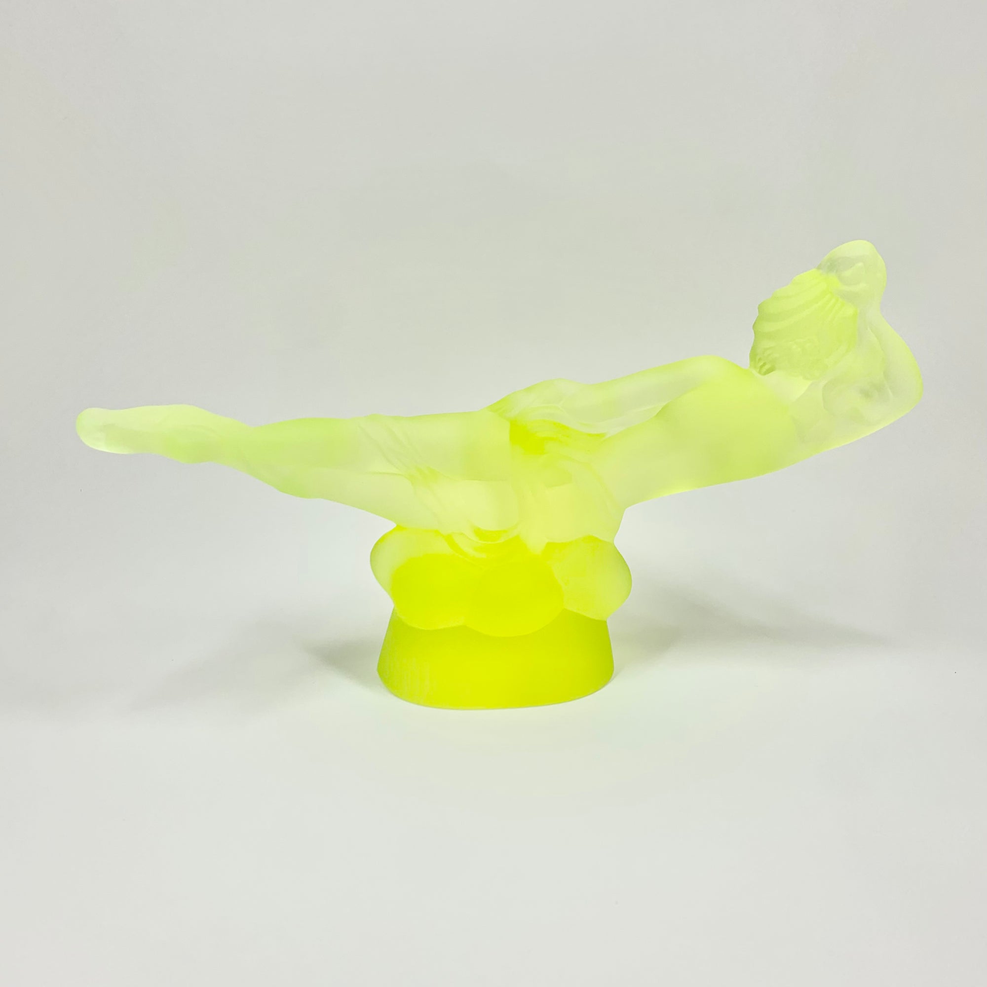 Art Deco reproduction of Lalique lie down Nude with star bangle cape figurine in uranium glass