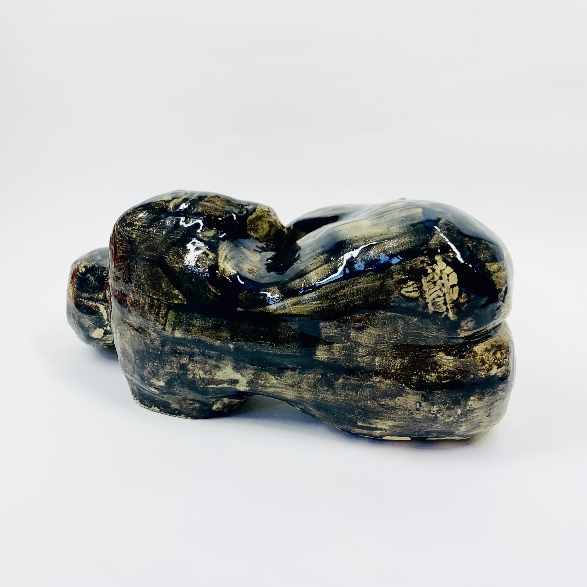 Australian pottery sculpture depicting woman clutching her stomach