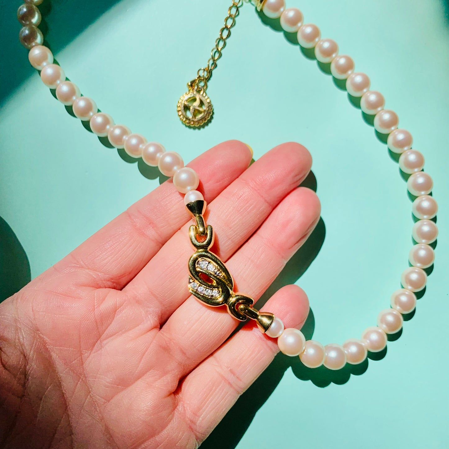 1960s Avon costume pearl necklace with infinity pendant