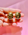 1960s Barcs triple gold plated ribbed cocoon clip on earrings by Monet