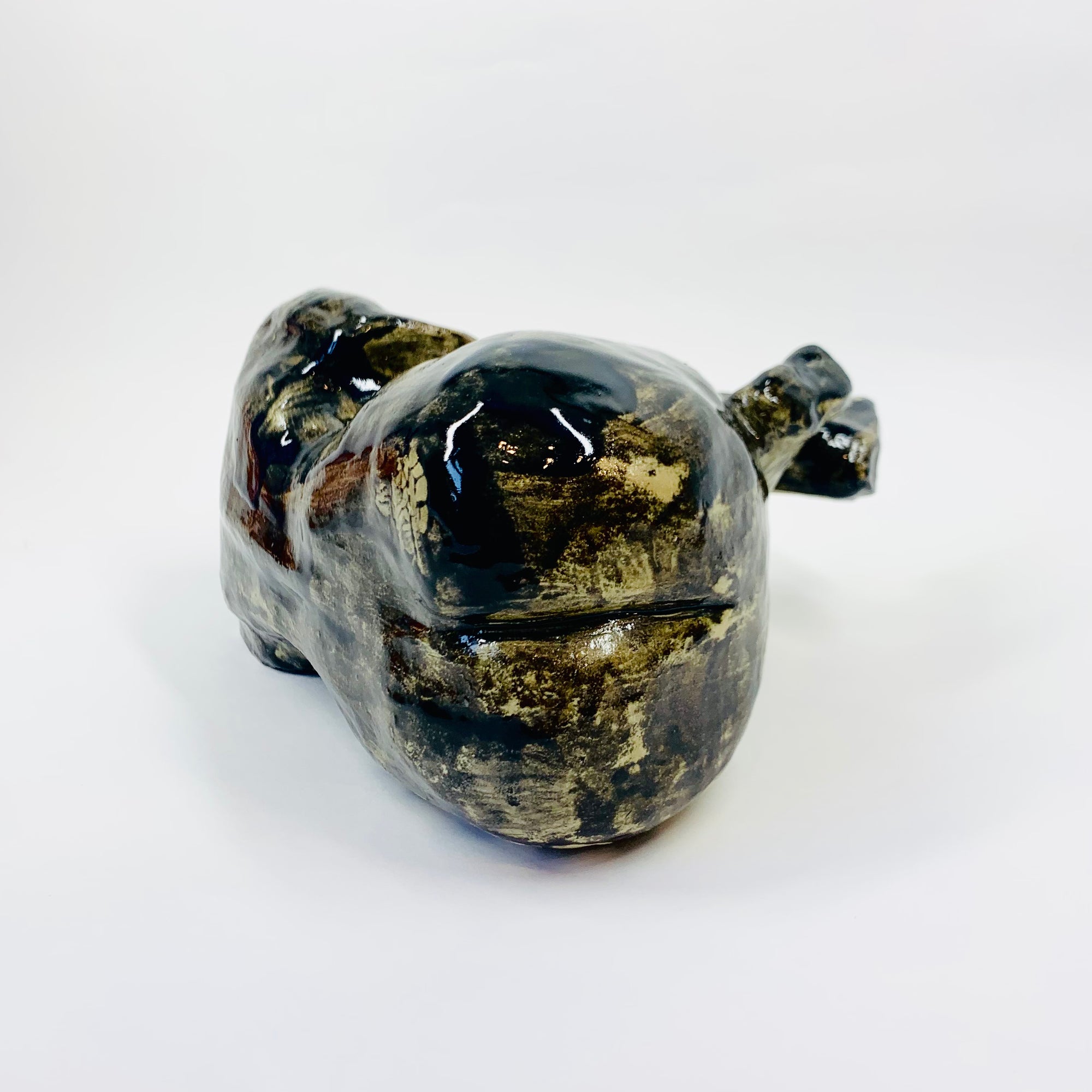 Australian pottery sculpture depicting woman clutching her stomach