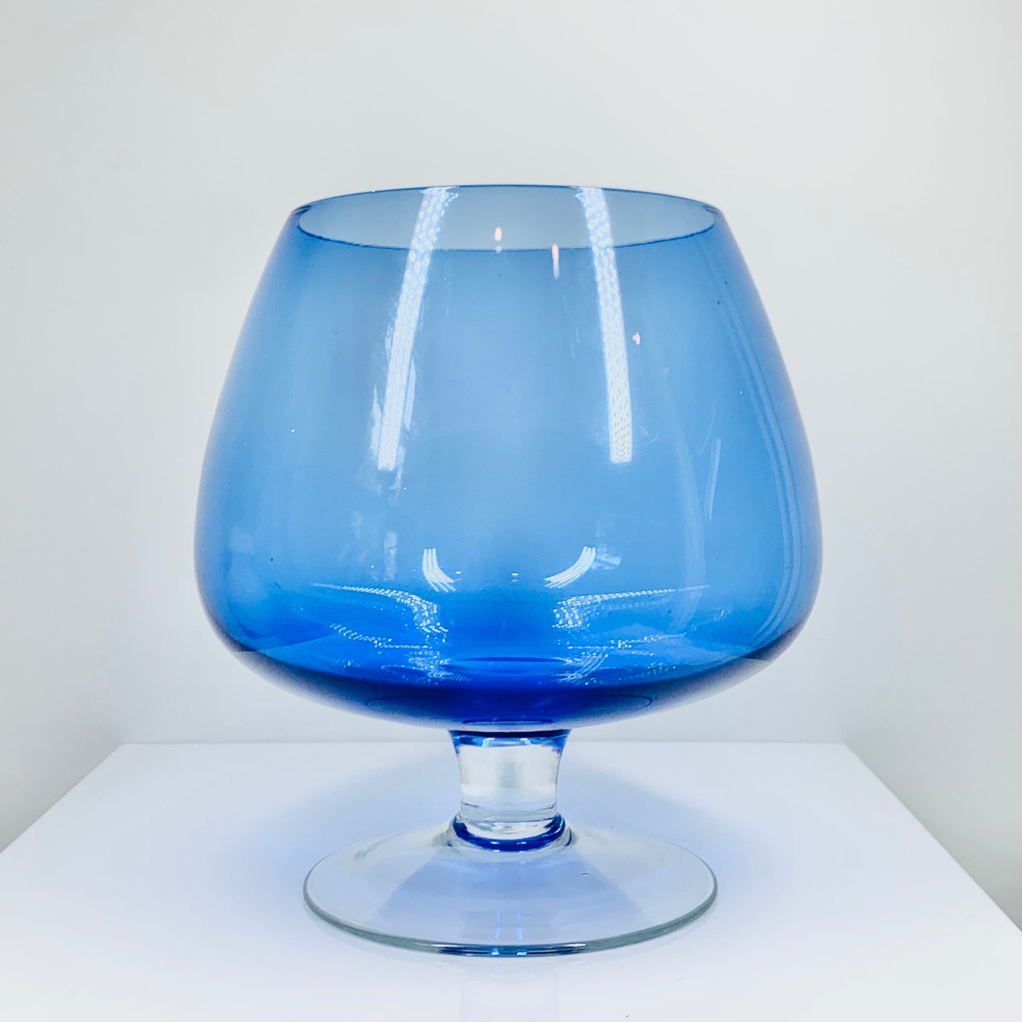 Large Midcentury Italian blue glass brandy balloon vase with clear stem
