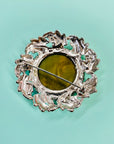 1940s silver nickel brooch with green cats-eye bead