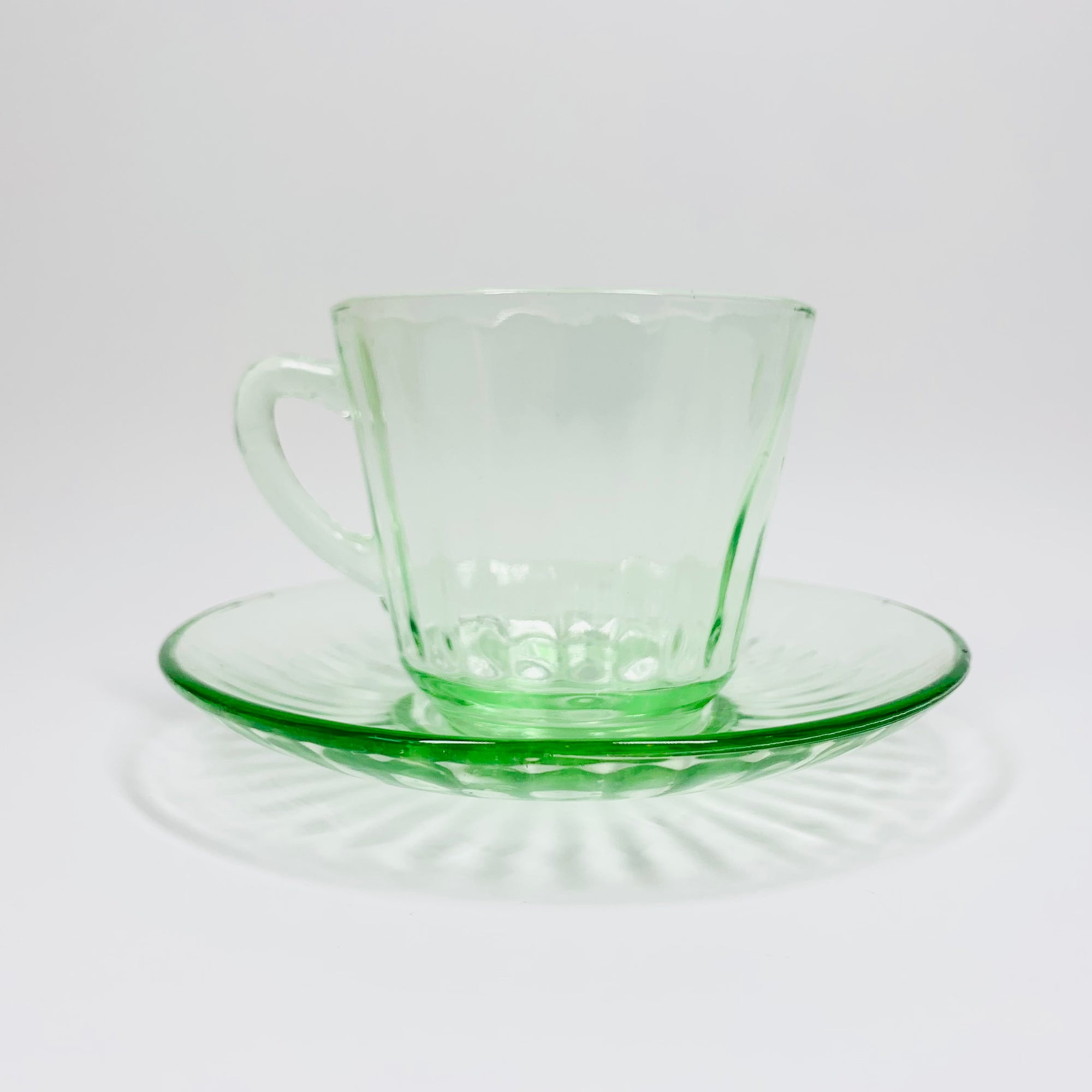 Extremely rare antique Art Deco green glass tea cup and matching saucer