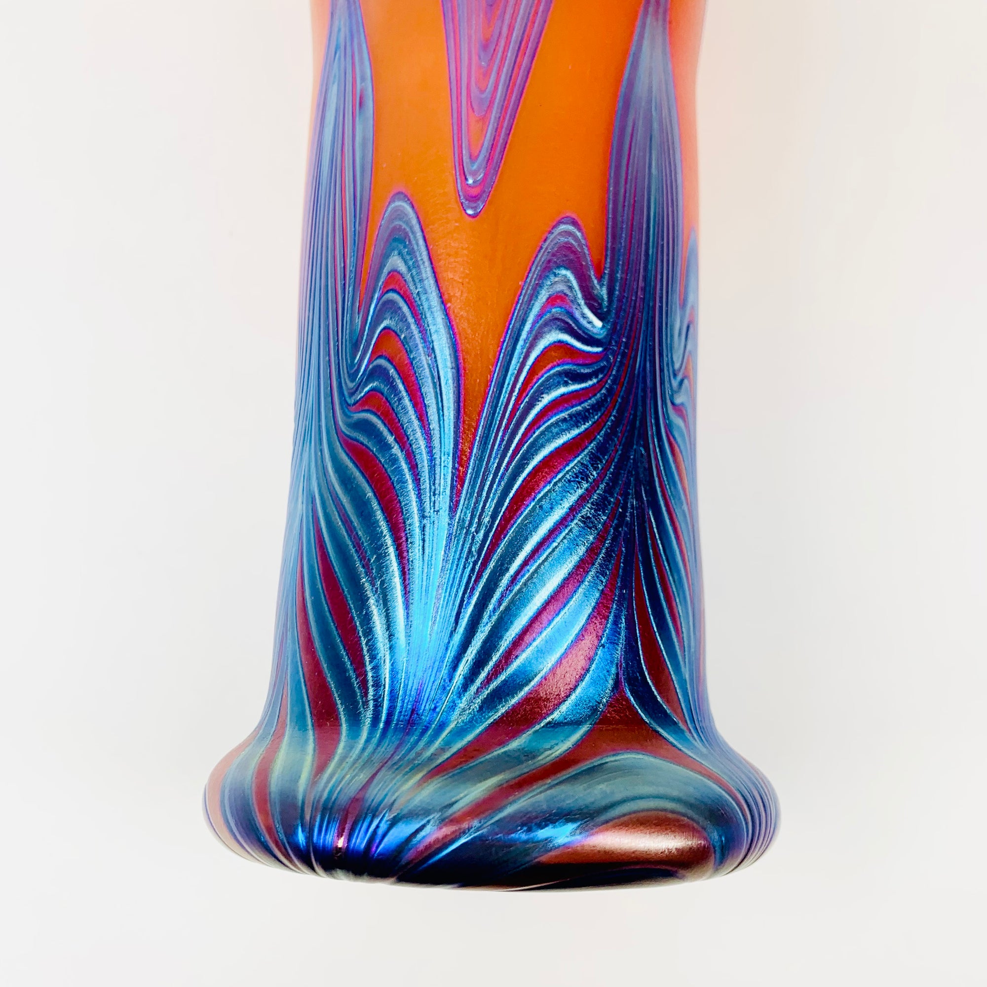 Mouth blown peacock orange and blue iridescent Art Nouveau style glass vase