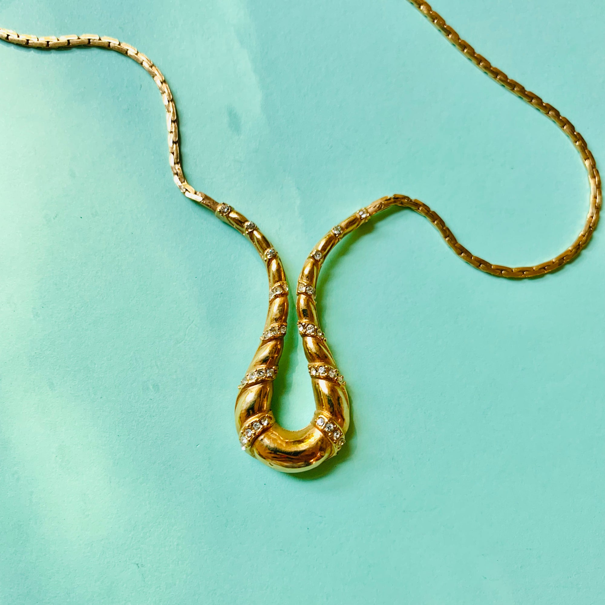 1970s Avon gold plated flat link necklace with rhinestones pendant