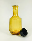 Midcentury glass oil carafe with plastic lid