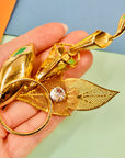 1970s flower brooch with center rhinestone