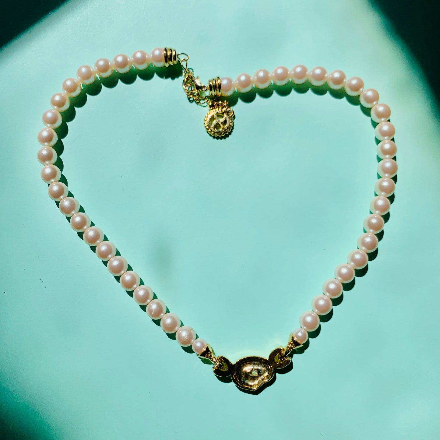 1960s Avon costume pearl necklace with infinity pendant