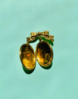 Antique brass bow locket brooch