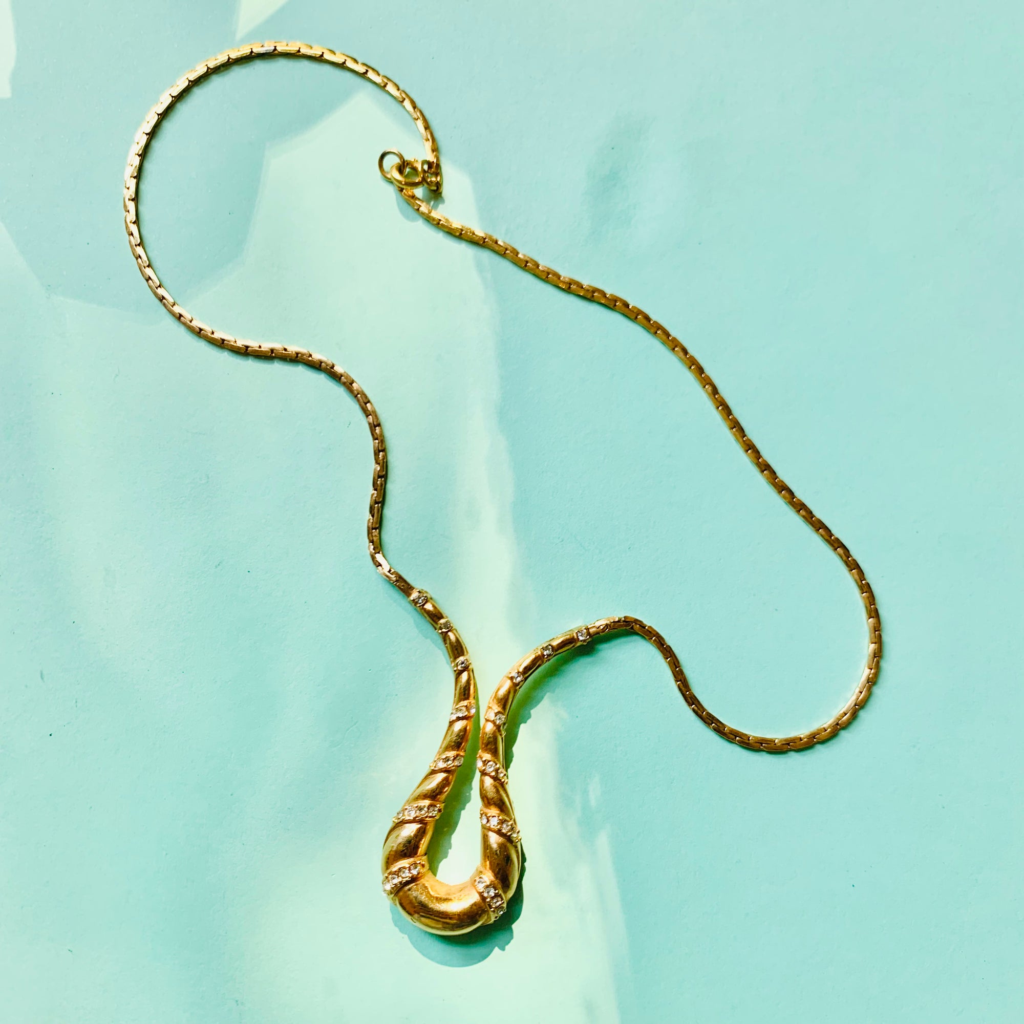 1970s Avon gold plated flat link necklace with rhinestones pendant