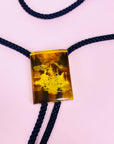 Extremely rare Midcentury Chinese carved amber bolo tie