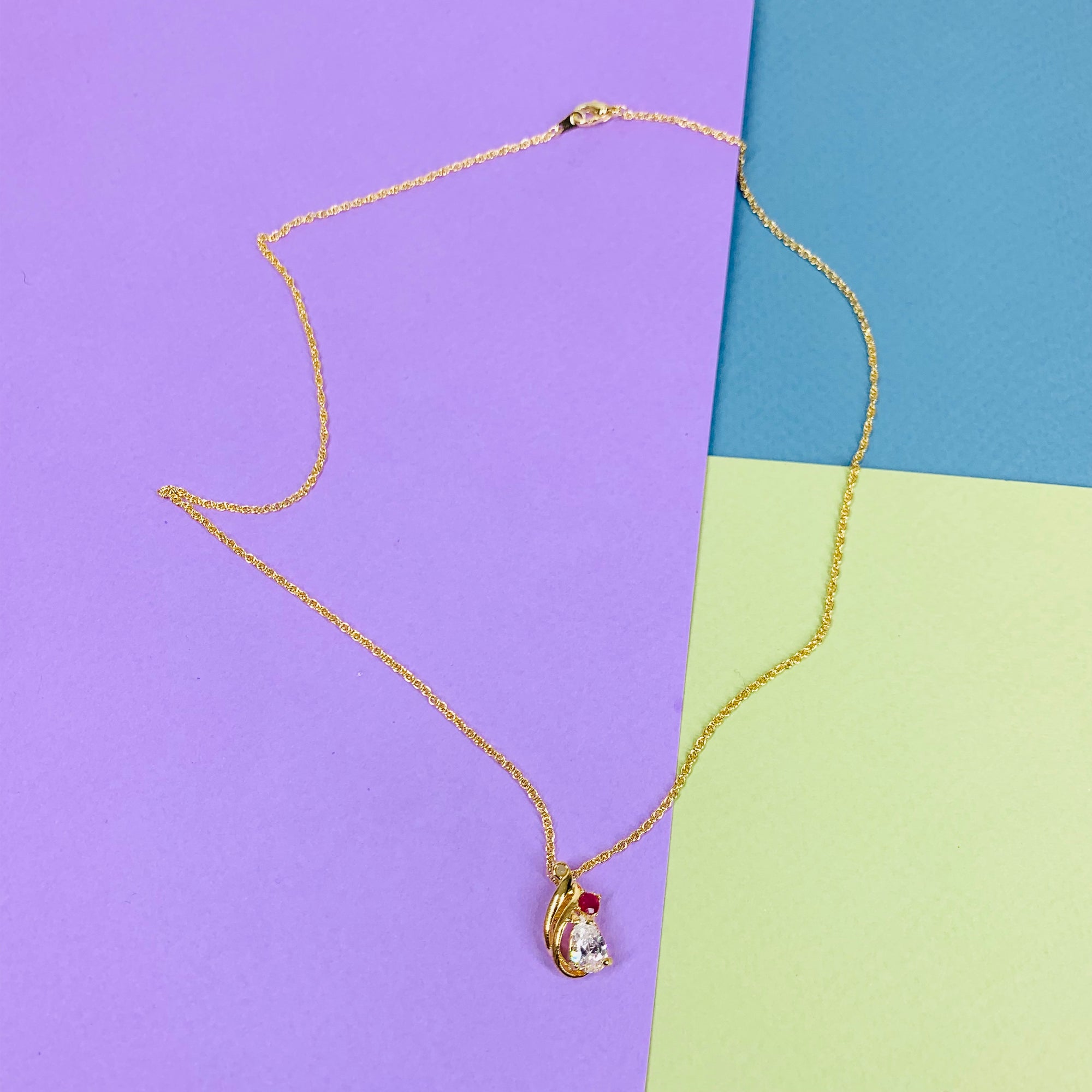 1970s Anson American triple plated gold necklace with ruby & clear crystal drop pendant