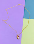 1970s Anson American triple plated gold necklace with ruby & clear crystal drop pendant
