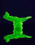 Art Deco reproduction of Lalique lie down Nude with star bangle cape figurine in uranium glass