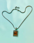 Vintage silver plated necklace with rectangular amber glass paste pendant