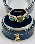 1970s 10K ROSE GOLD TRILOGY RING WITH EMERALD & PERIDOT CABOCHON