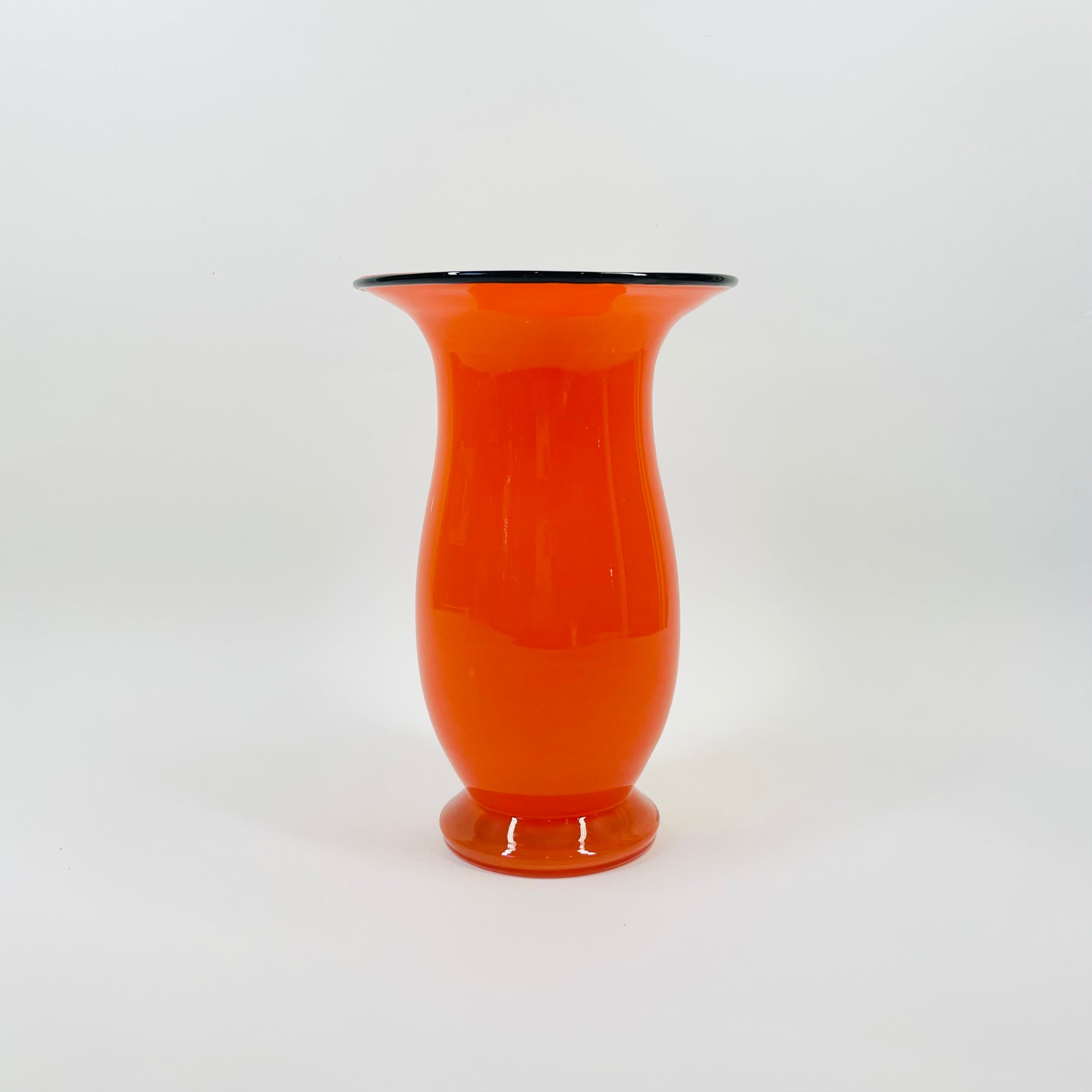 ANTIQUE CASED ORANGE GLASS POSY VASE WITH BLACK RIM