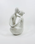 1980s COMPOSITE STONE EMBRACING COUPLE SCULPTURE