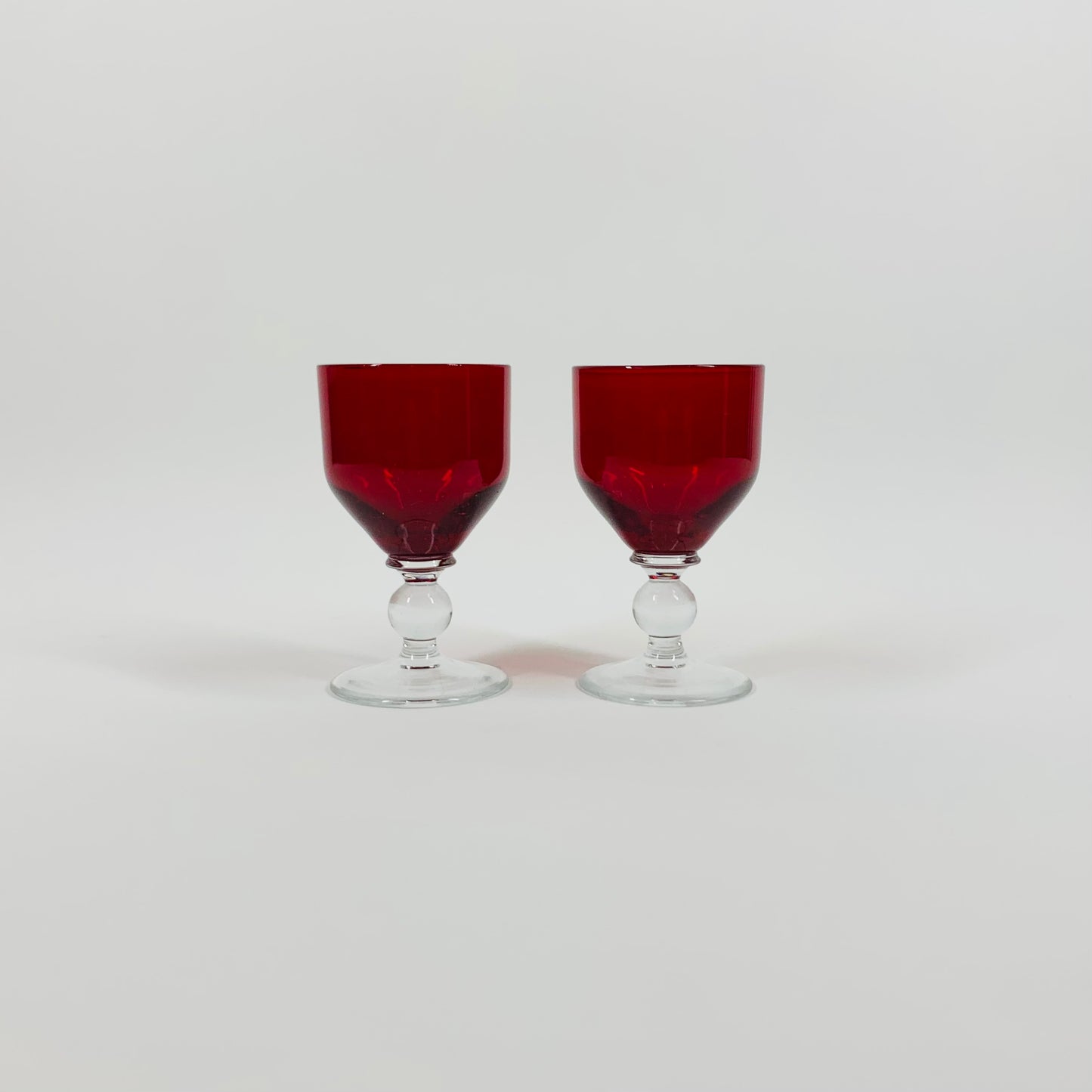 1950s ASTRACOKOUR RUBY FOOTED SHOT GLASSES