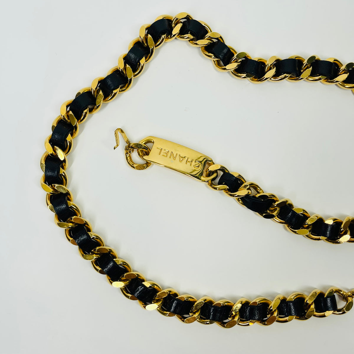 1980s CHANEL BLACK LEATHER GOLD PLATED LOGO BELT
