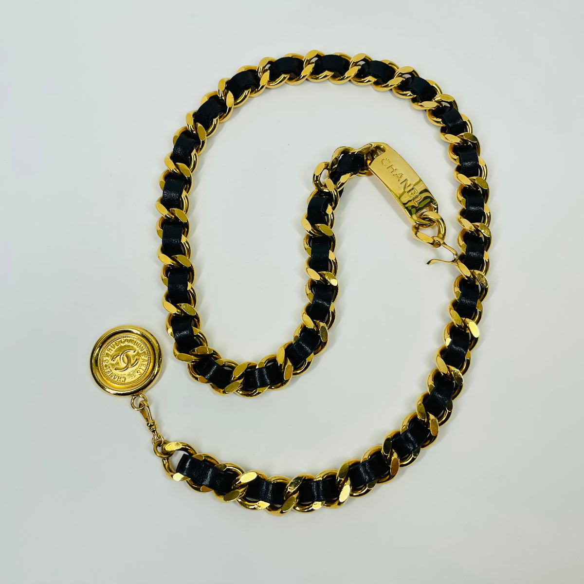 1980s CHANEL BLACK LEATHER GOLD PLATED LOGO BELT
