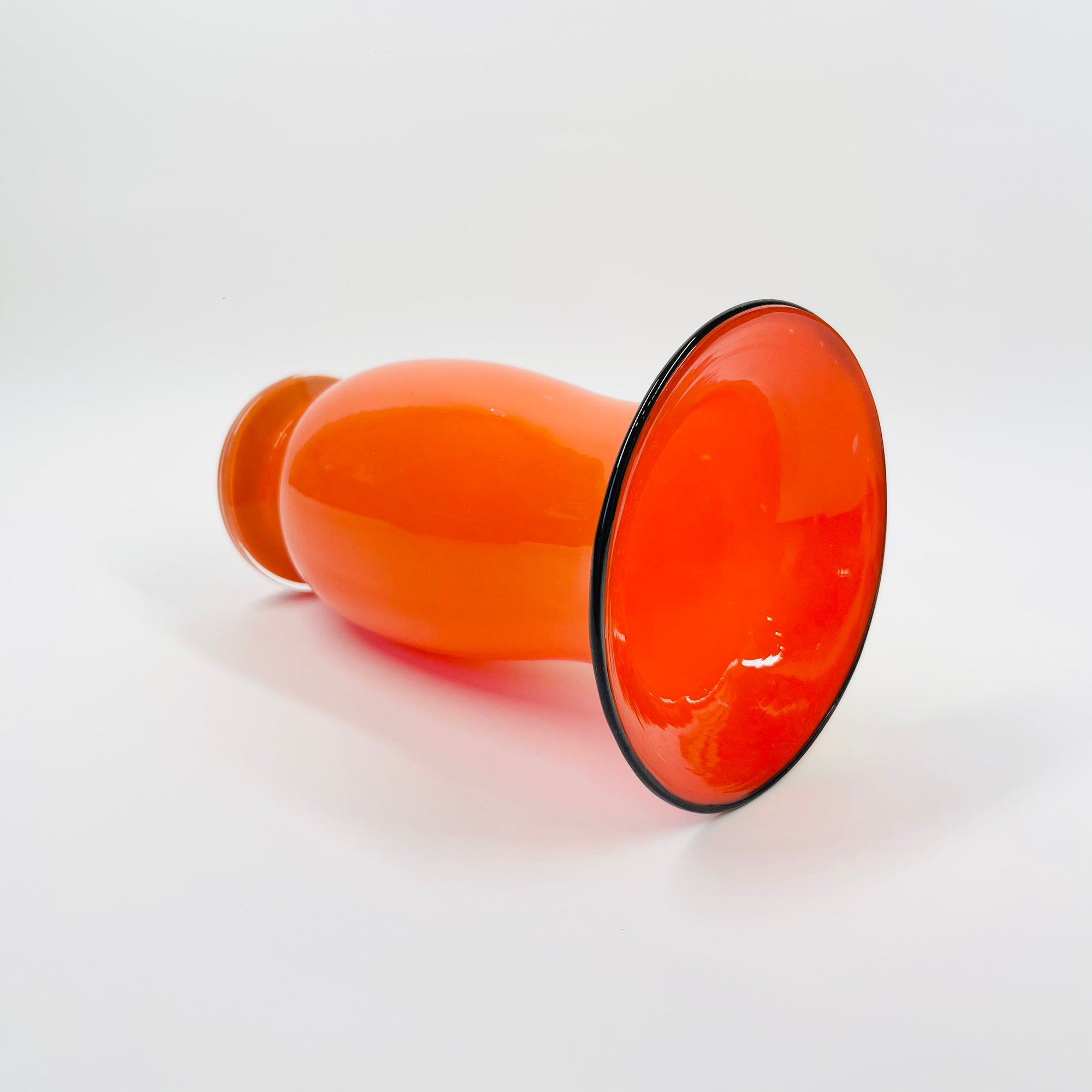 ANTIQUE CASED ORANGE GLASS POSY VASE WITH BLACK RIM