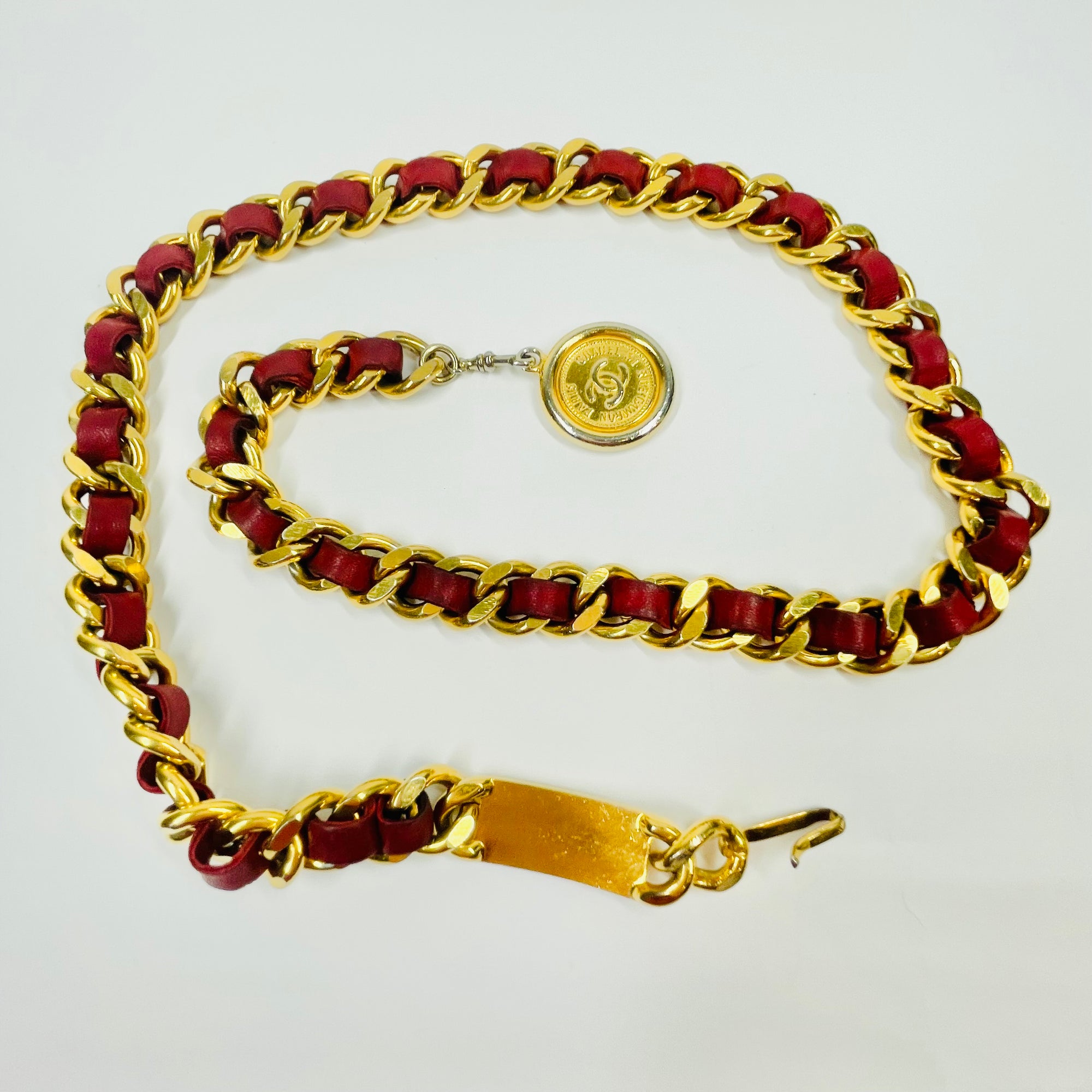 1980s CHANEL RED/BURGUNDY LEATHER GOLD PLATED LOGO BELT
