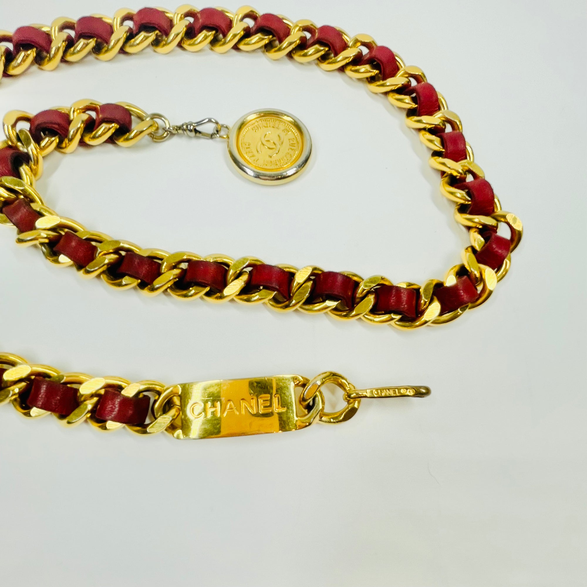 1980s CHANEL RED/BURGUNDY LEATHER GOLD PLATED LOGO BELT