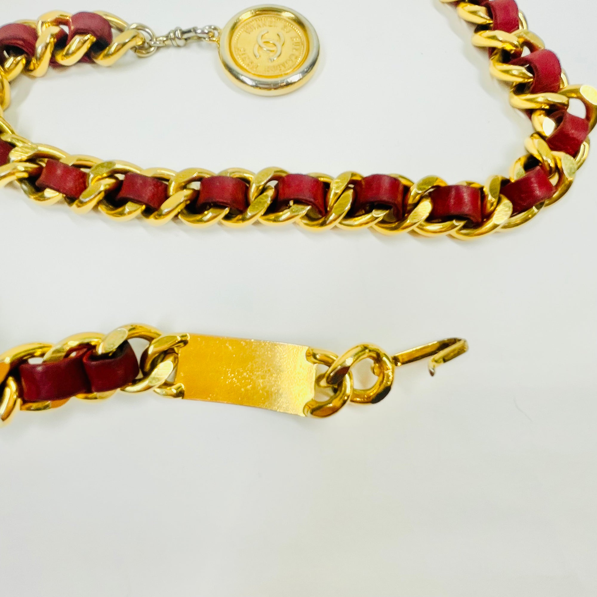 1980s CHANEL RED/BURGUNDY LEATHER GOLD PLATED LOGO BELT