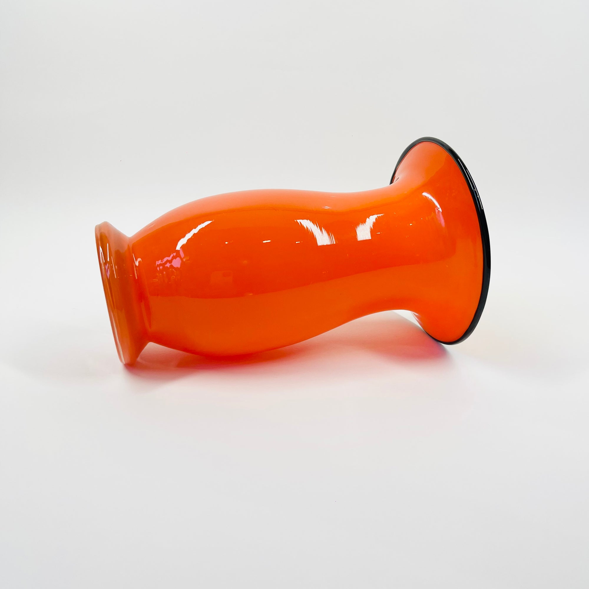 ANTIQUE CASED ORANGE GLASS POSY VASE WITH BLACK RIM