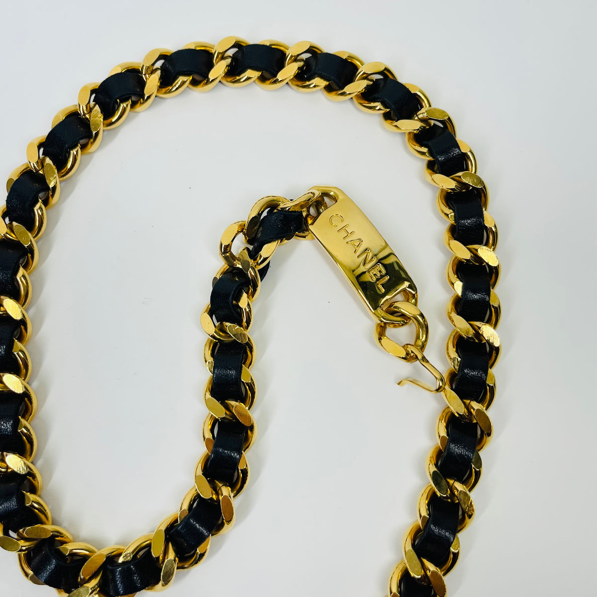 1980s CHANEL BLACK LEATHER GOLD PLATED LOGO BELT