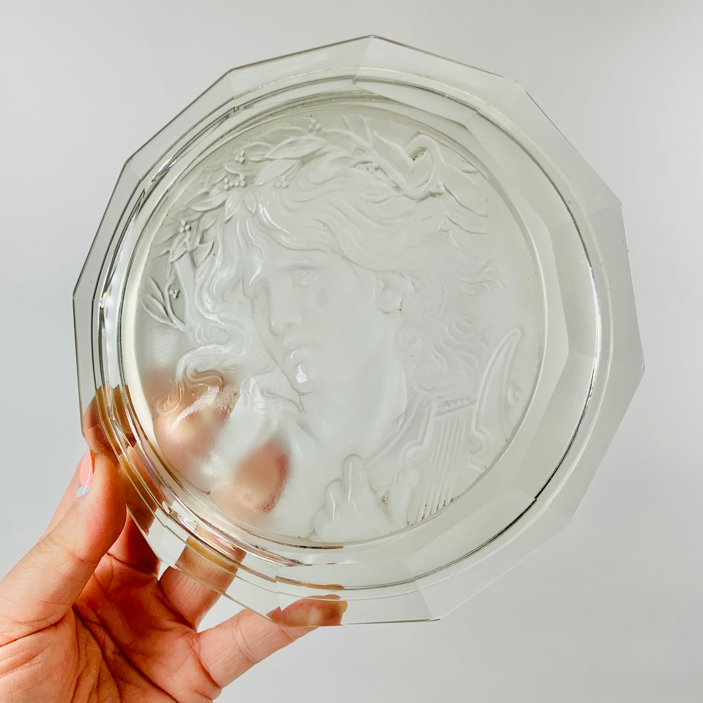 Rare antique pressed glass plate with the God Apollo relief