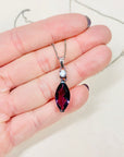 Antique sterling silver drop pendant necklace with purple glass paste