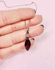 Antique sterling silver drop pendant necklace with purple glass paste