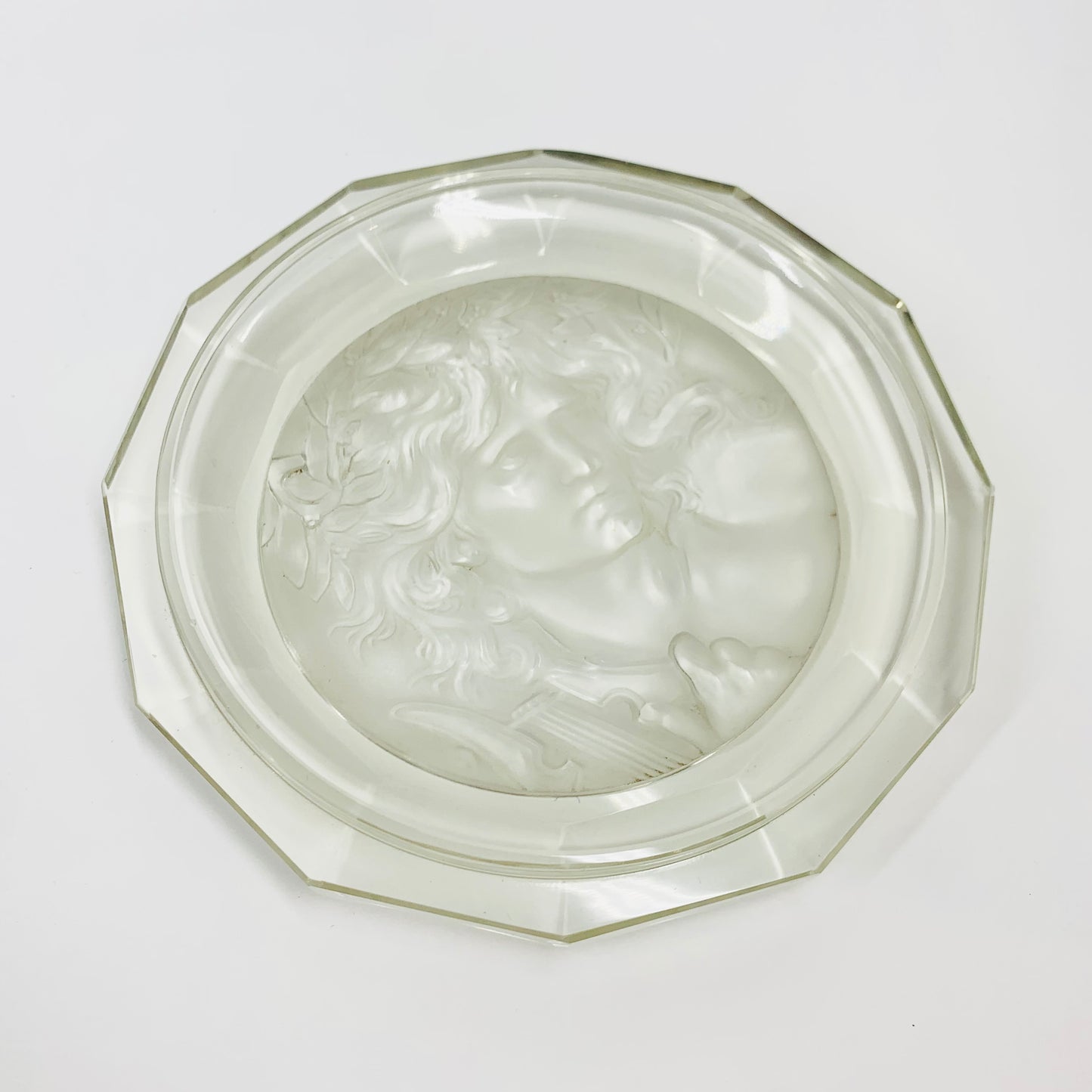 Rare antique pressed glass plate with the God Apollo relief