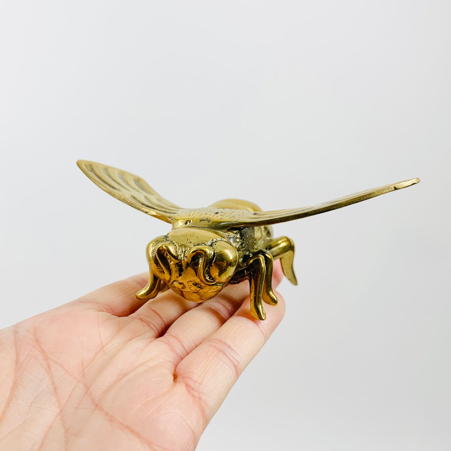 Antique brass bee