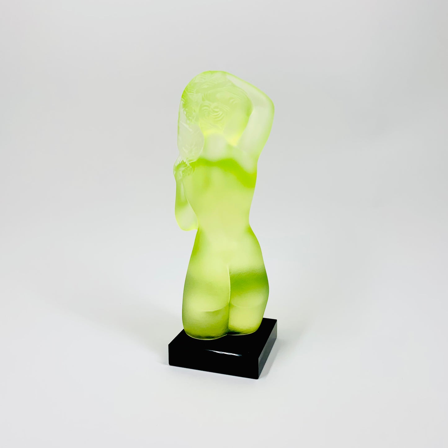 Art Deco reproduction of Lalique Venus figurine in uranium glass on black marble stand