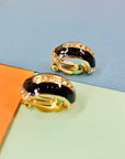 Stunning 1960s gold plated clip on black enamel earrings with rhinestones