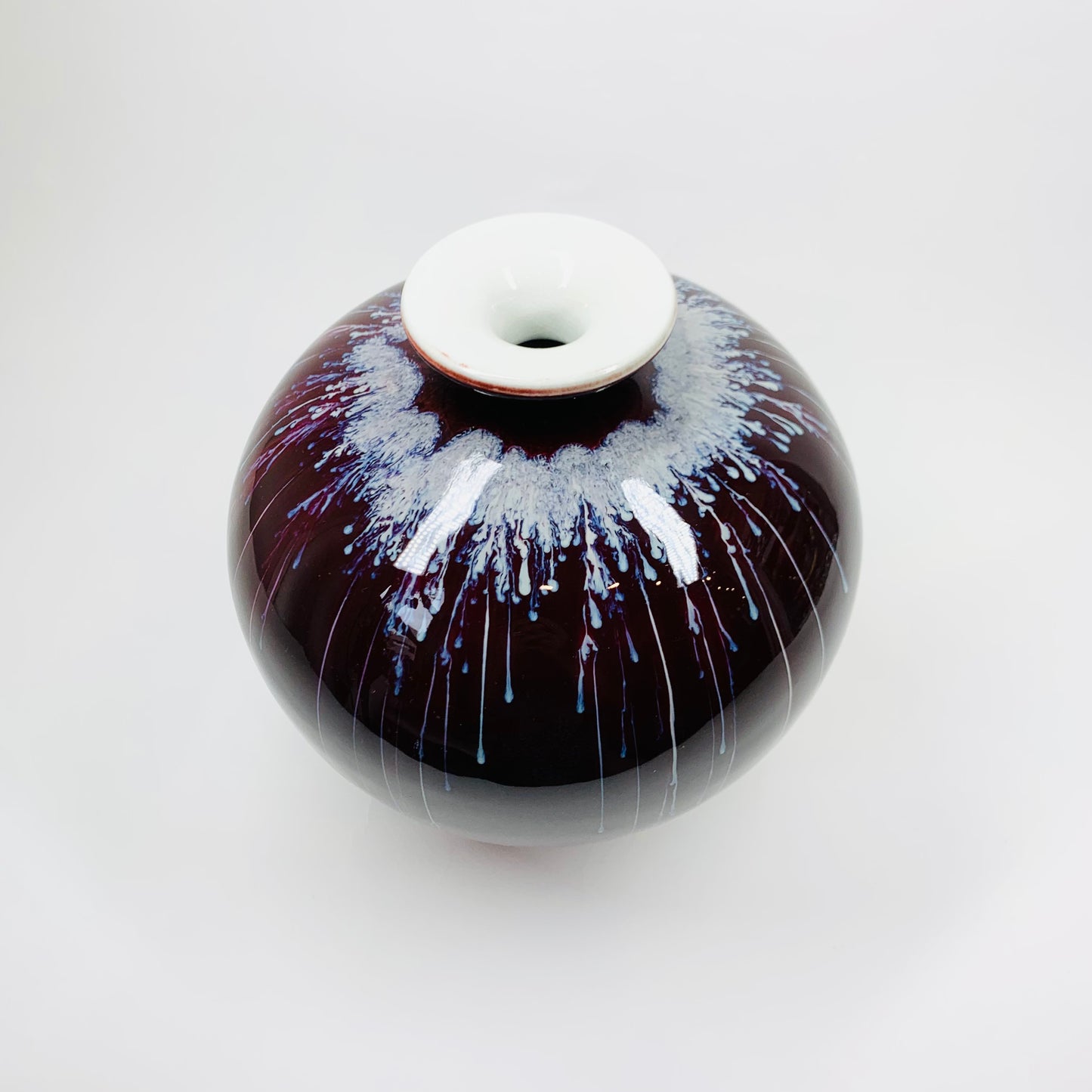 Vintage Chinese maroon bleed flambé pottery squat vase