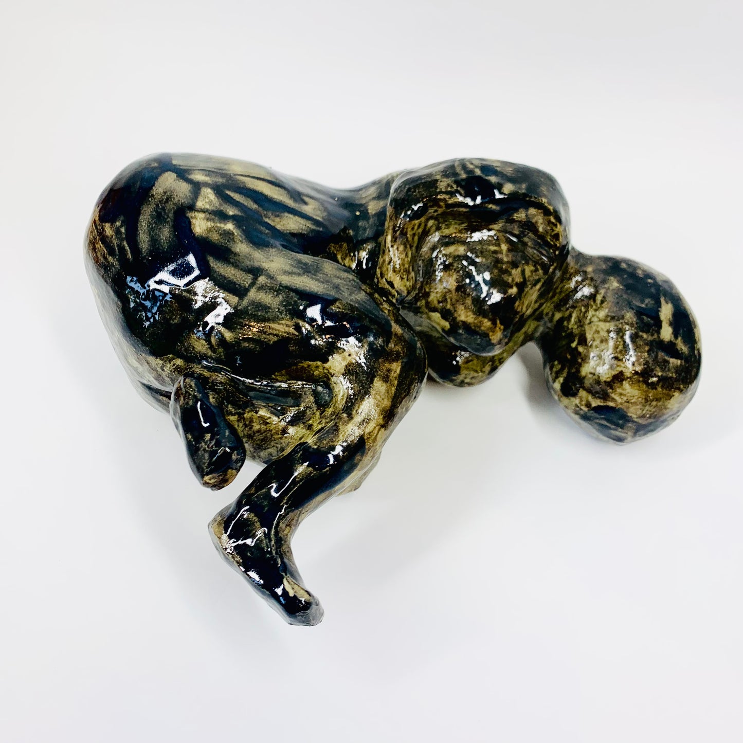 Australian pottery sculpture depicting woman clutching her stomach