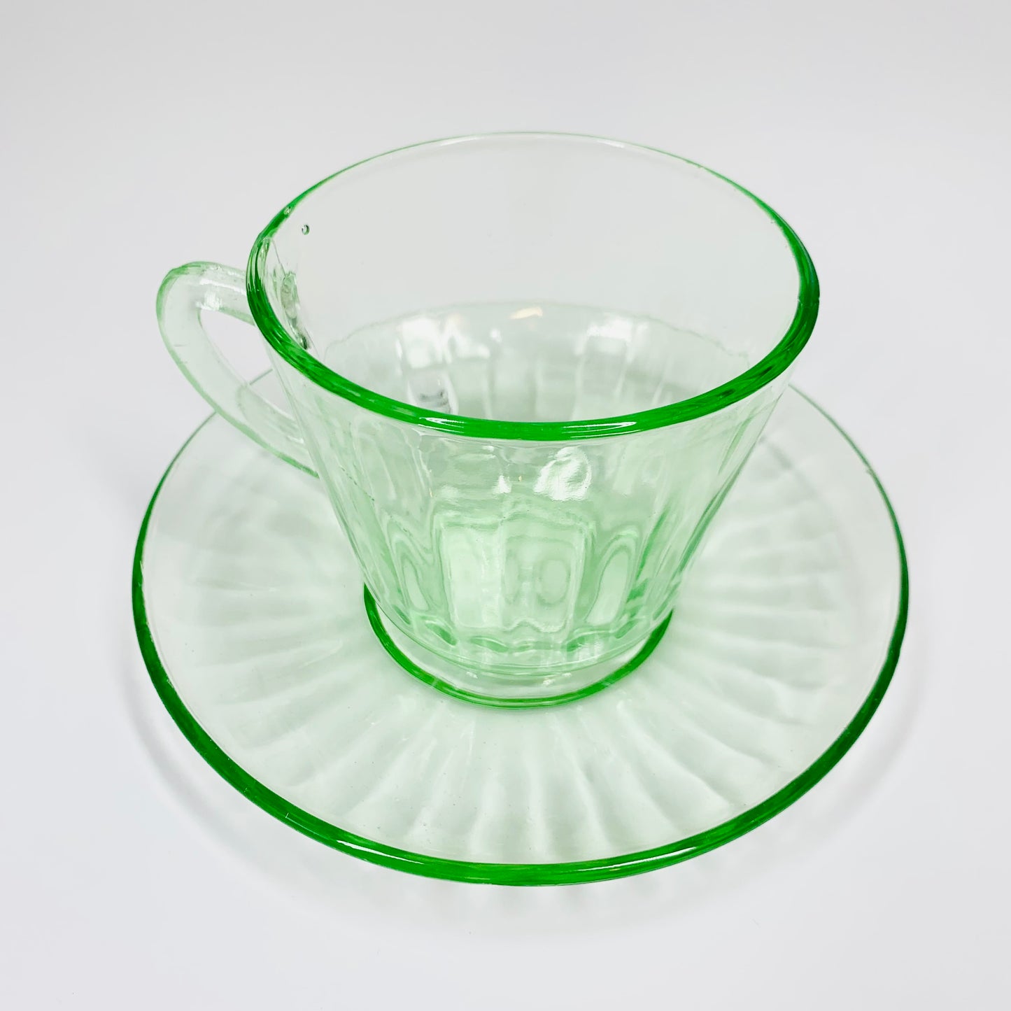 Extremely rare antique Art Deco green glass tea cup and matching saucer
