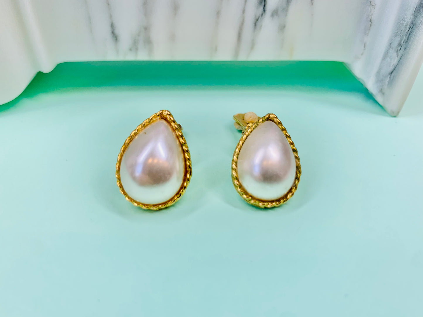 1960s gold plated clip on pearl button earrings with filigree border