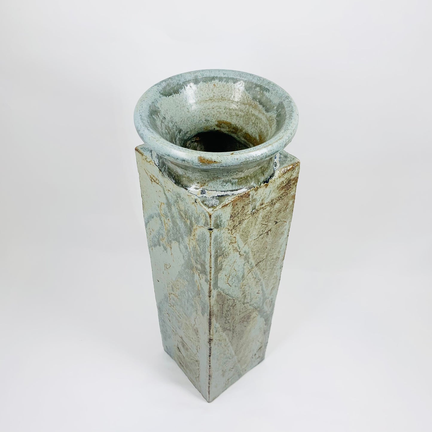 Modernist tall Japanese thick green glazed pottery vase with intentional rust glaze